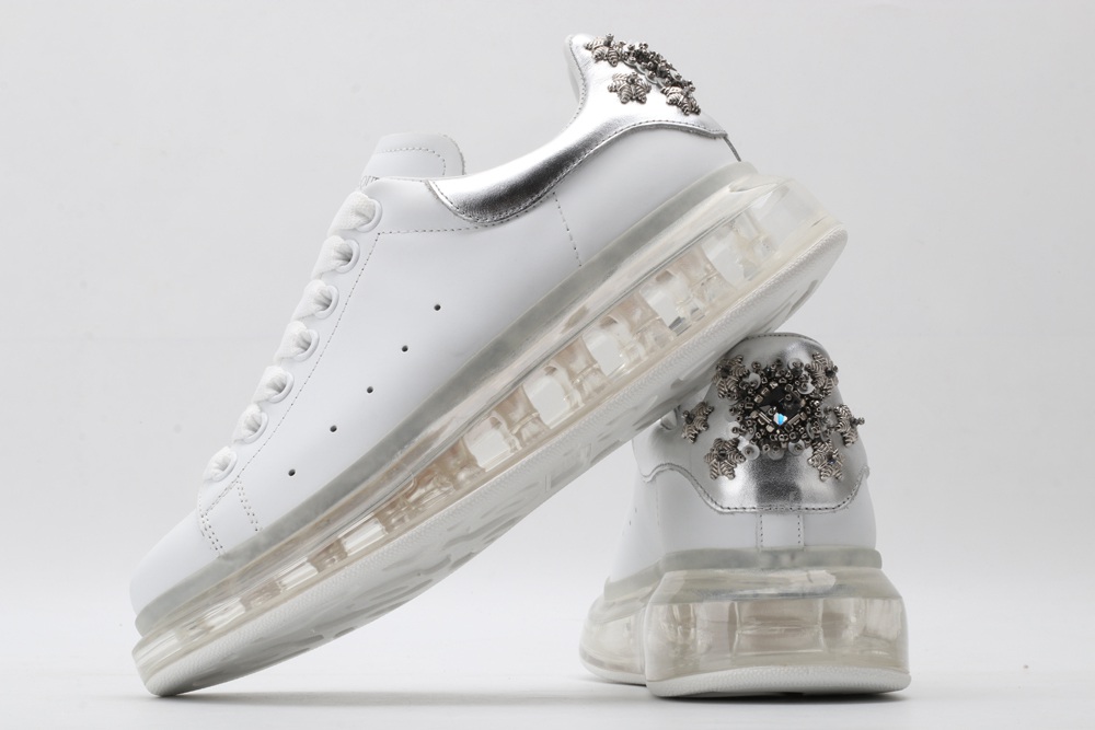 AMQ white oversized sneakers with siL*Ver heel