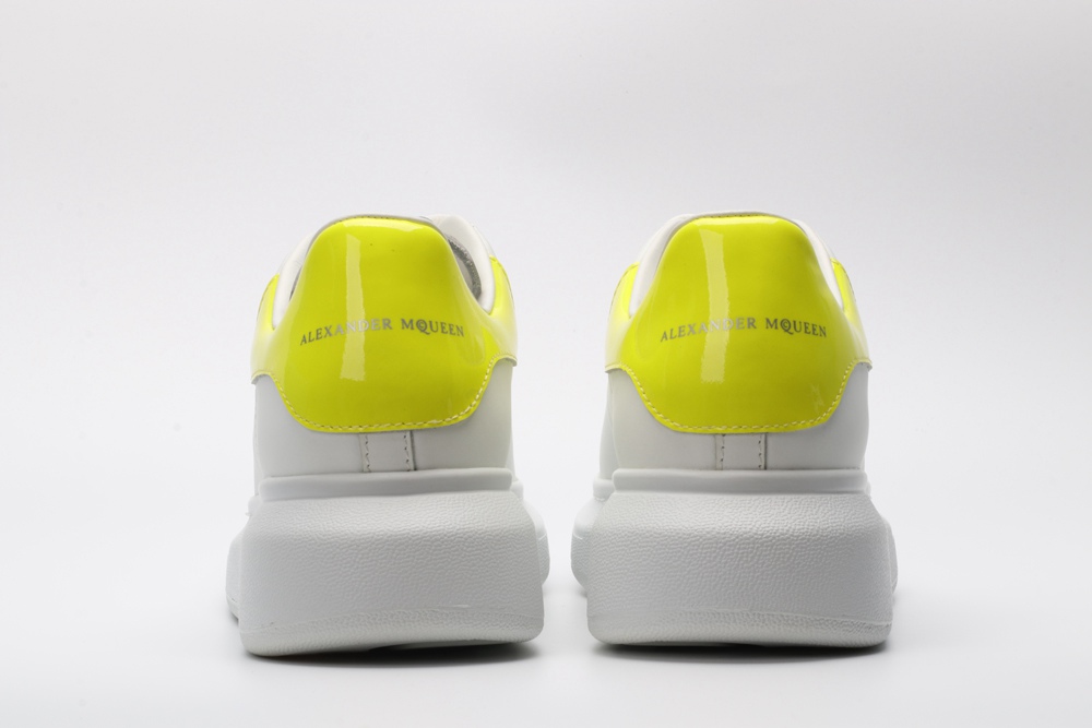AMQ yellow foil embellished chunky leather sneakers
