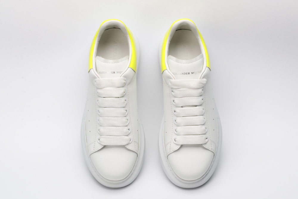 AMQ yellow foil embellished chunky leather sneakers