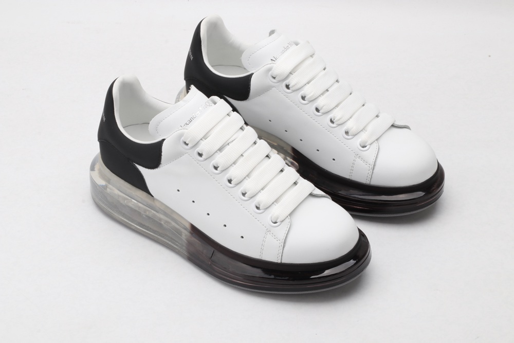 AMQ white oversized sneakers with black heel