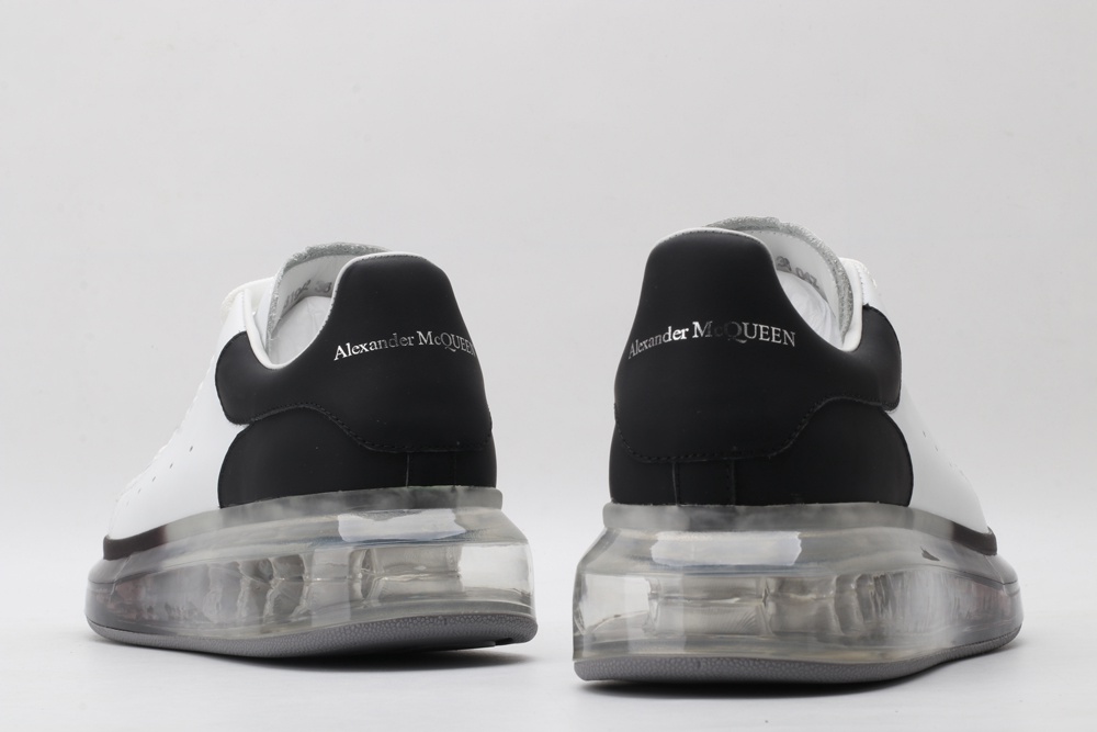 AMQ white oversized sneakers with black heel