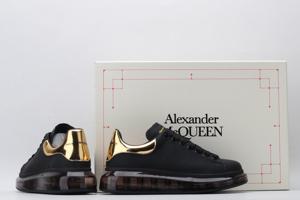 AMQ black oversized sneakers with gold heel