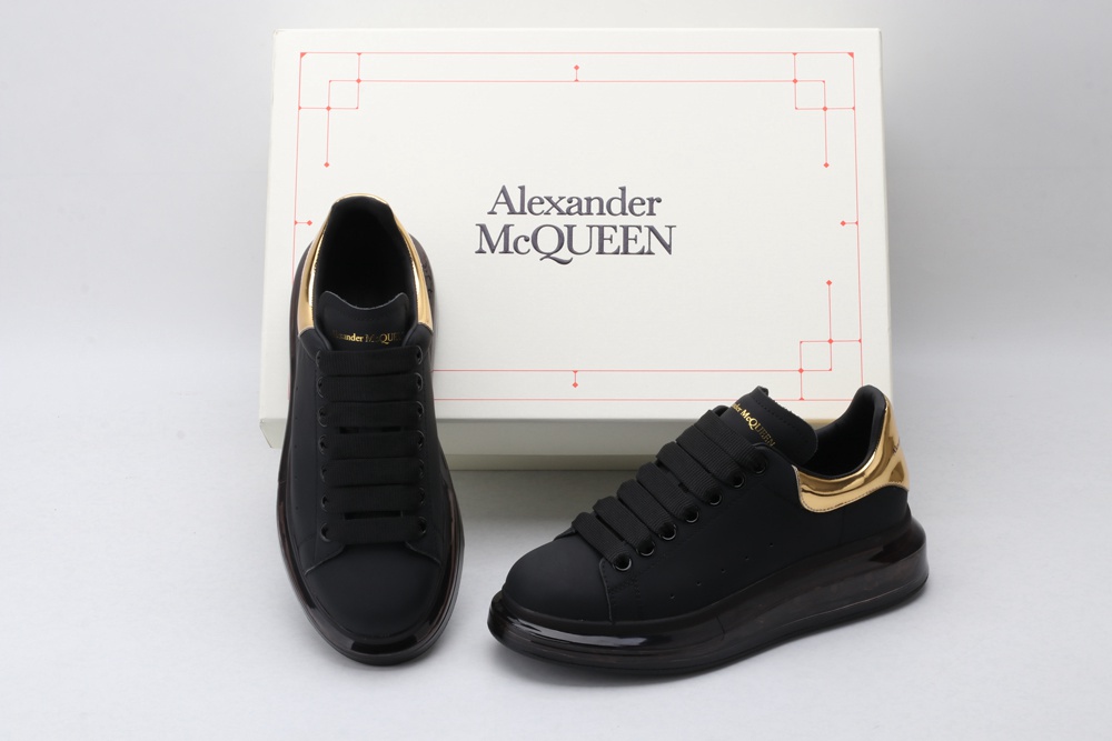 AMQ black oversized sneakers with gold heel