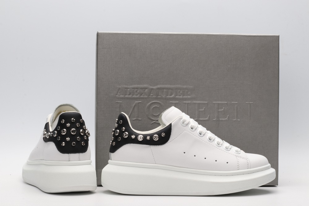 White calf leather lace-up sneaker trimmed with contrasting-color black calf leather heel