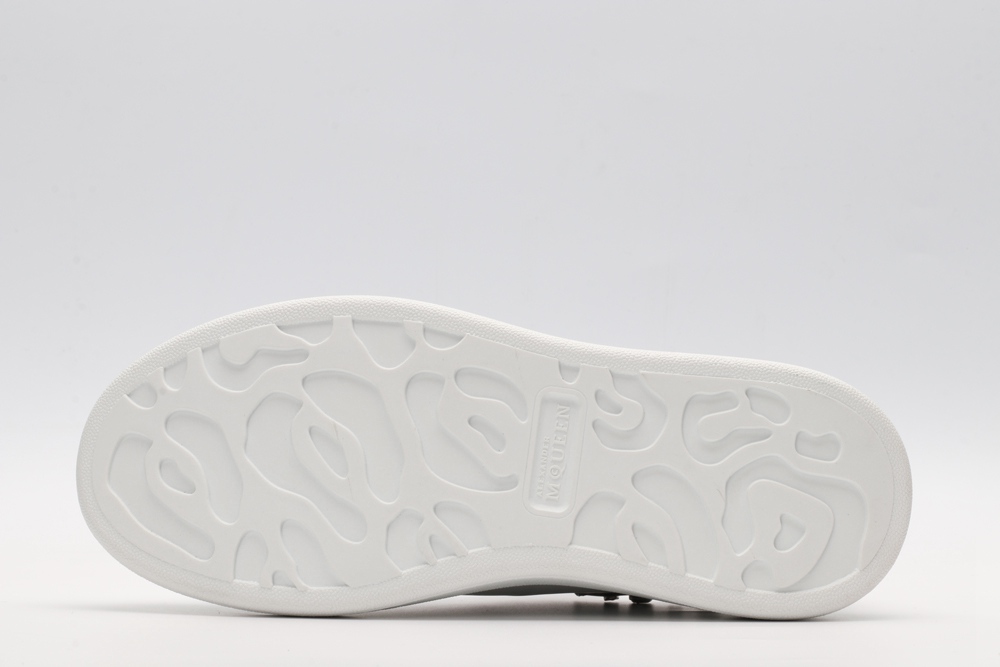 White calf leather lace-up sneaker trimmed with contrasting-color black calf leather heel