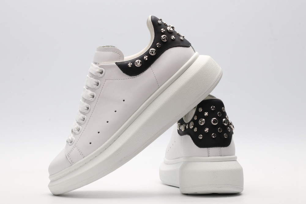 White calf leather lace-up sneaker trimmed with contrasting-color black calf leather heel