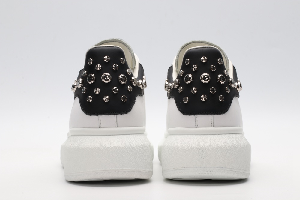 White calf leather lace-up sneaker trimmed with contrasting-color black calf leather heel