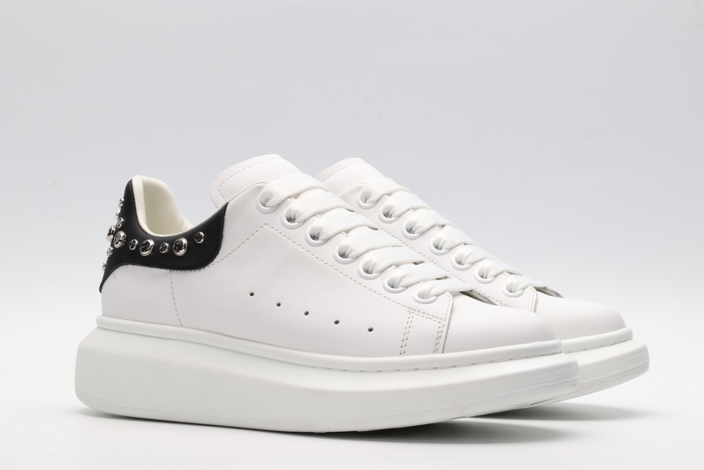 White calf leather lace-up sneaker trimmed with contrasting-color black calf leather heel