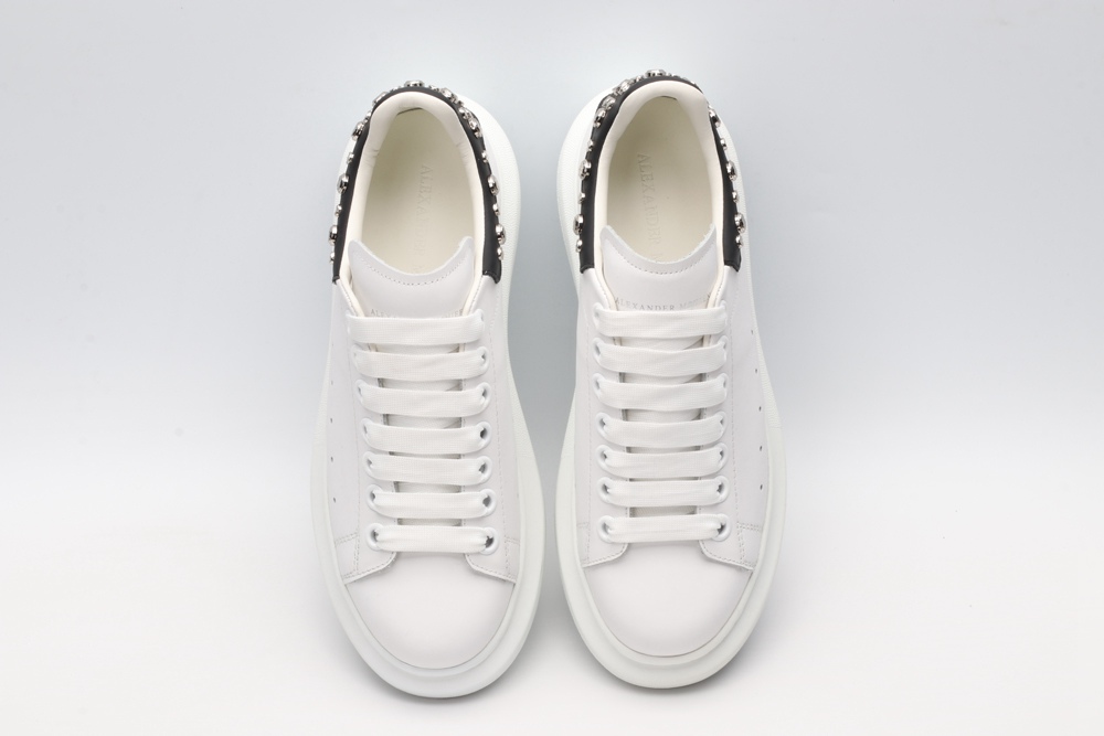 White calf leather lace-up sneaker trimmed with contrasting-color black calf leather heel