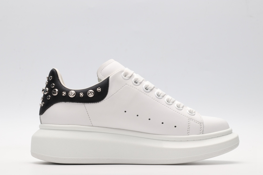 White calf leather lace-up sneaker trimmed with contrasting-color black calf leather heel