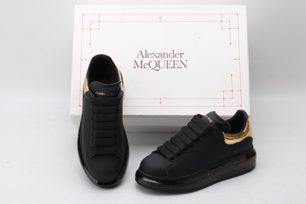 AMQ oversized sneakers black with gold heel