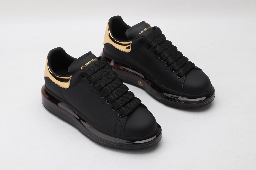 AMQ oversized sneakers black with gold heel