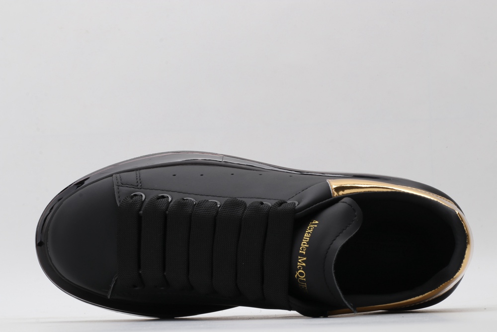 AMQ oversized sneakers black with gold heel