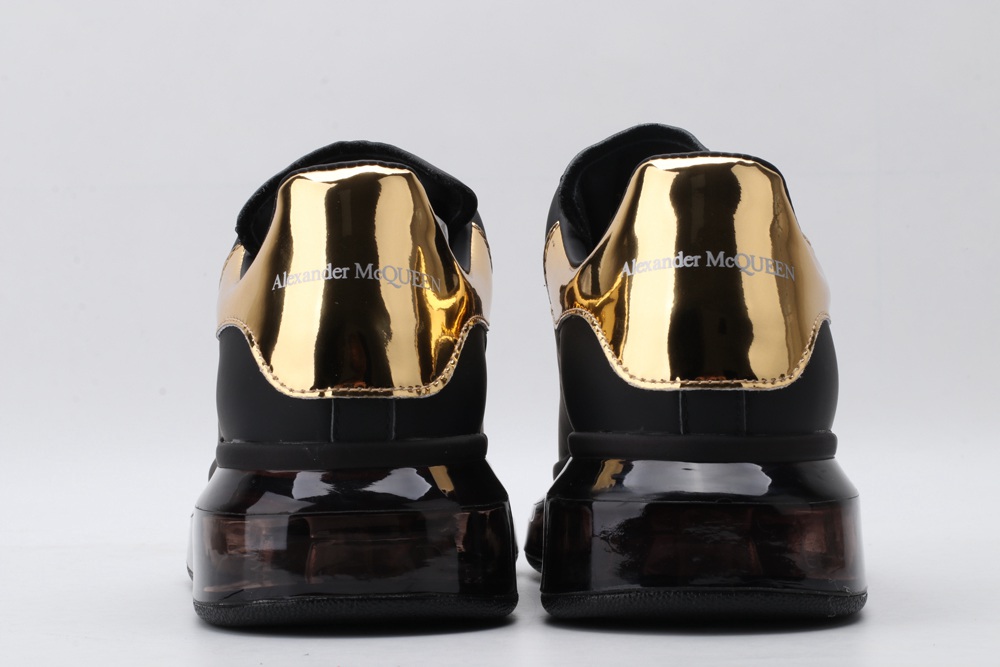 AMQ oversized sneakers black with gold heel