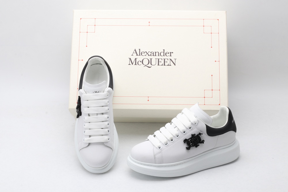 AMQ white oversized sneakers with black heel
