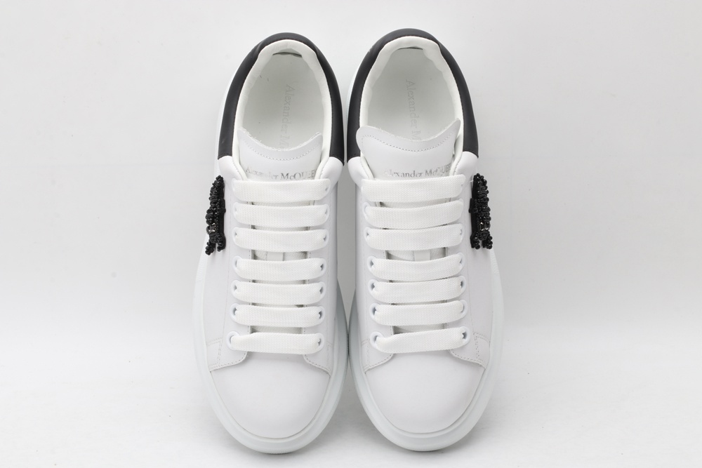 AMQ white oversized sneakers with black heel
