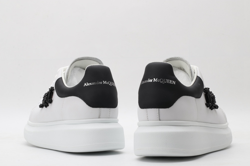 AMQ white oversized sneakers with black heel