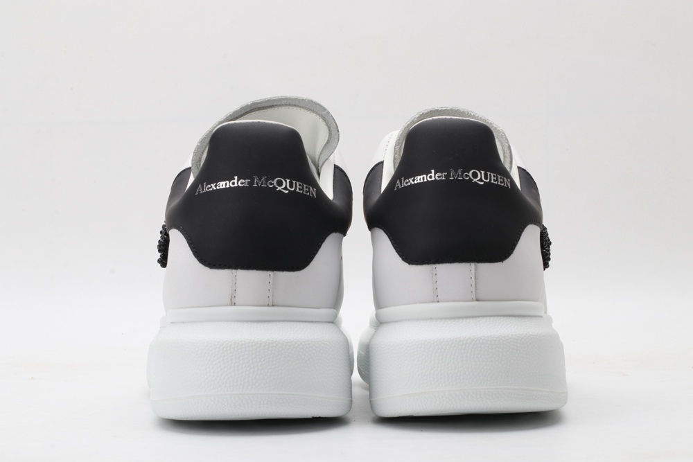 AMQ white oversized sneakers with black heel