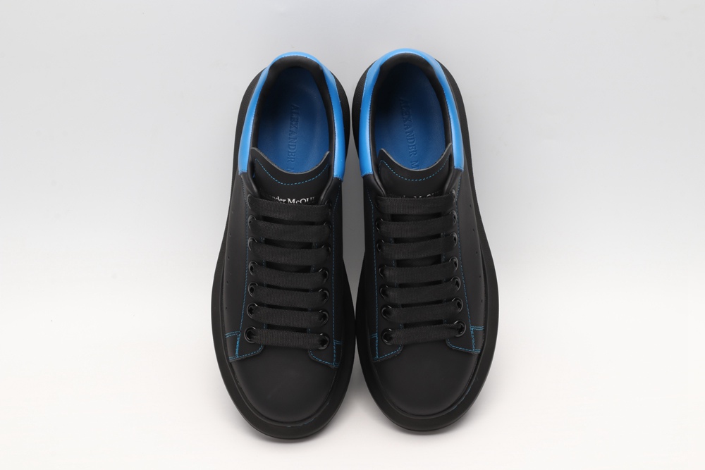 AMQ black oversized sneakers with blue heel