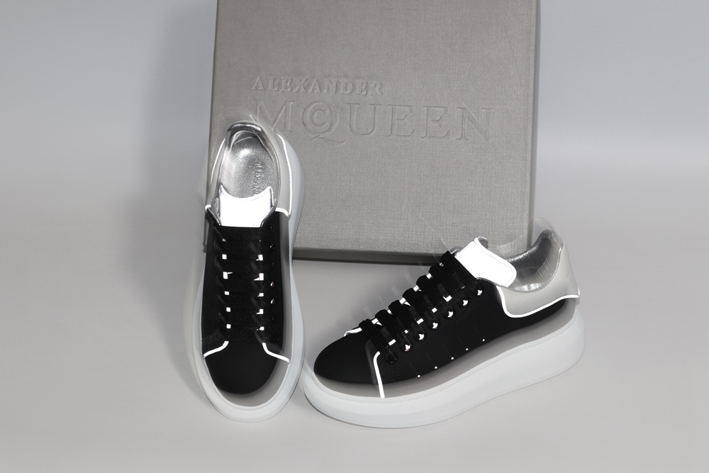 AMQ black oversized sneakers with siL*Ver heel
