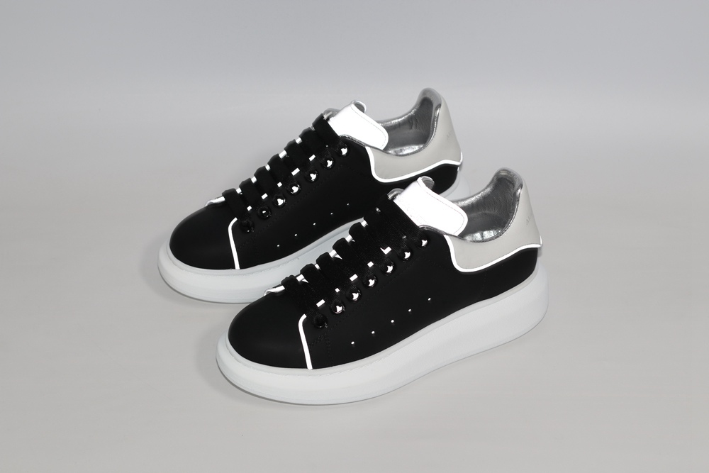 AMQ black oversized sneakers with siL*Ver heel