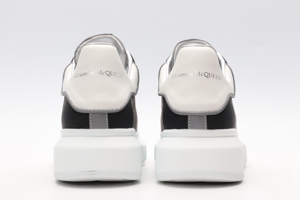 AMQ black oversized sneakers with siL*Ver heel