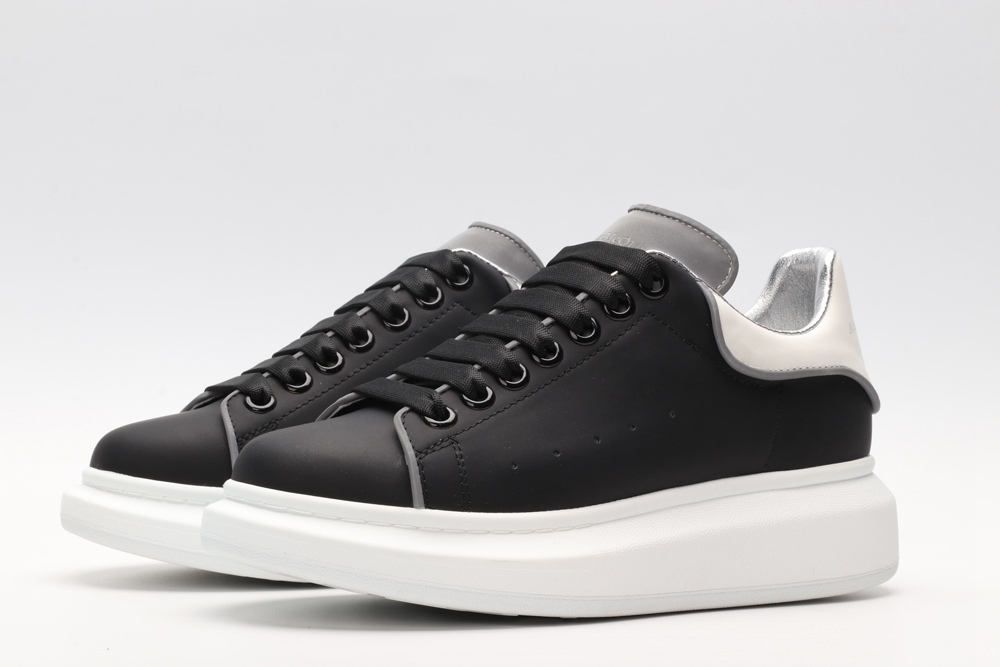 AMQ black oversized sneakers with siL*Ver heel
