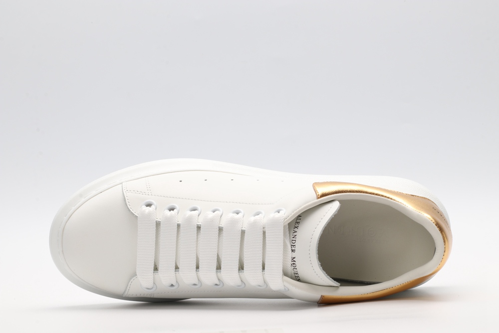 AMQ OVERSIZED SNEAKER with gold grain leather heel