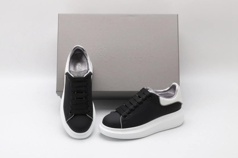 AMQ oversized black sneakers with white heel