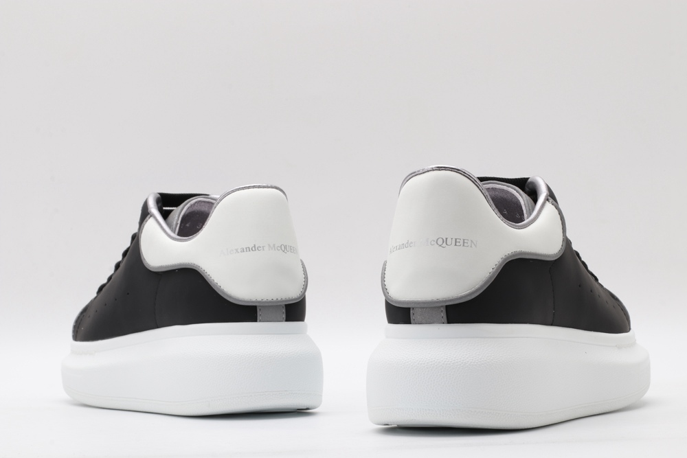 AMQ oversized black sneakers with white heel