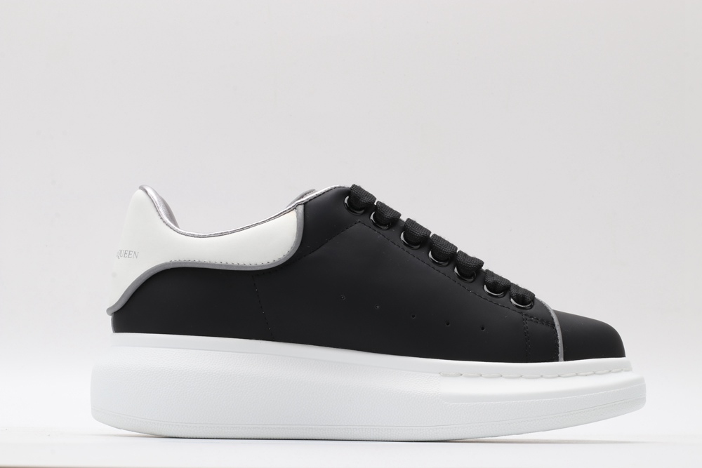 AMQ oversized black sneakers with white heel