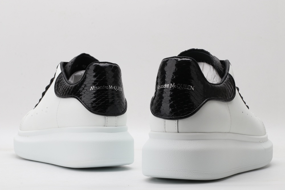 AMQ OVERSIZED SNEAKER with blue stamped python heel