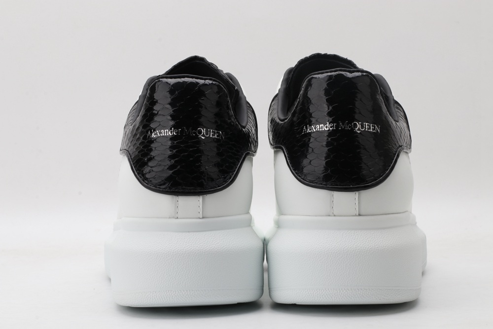 AMQ OVERSIZED SNEAKER with blue stamped python heel