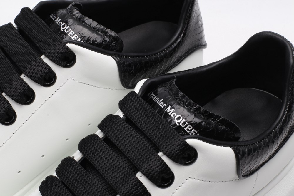 AMQ OVERSIZED SNEAKER with blue stamped python heel