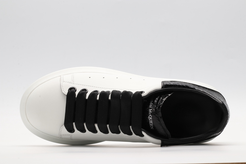 AMQ OVERSIZED SNEAKER with blue stamped python heel