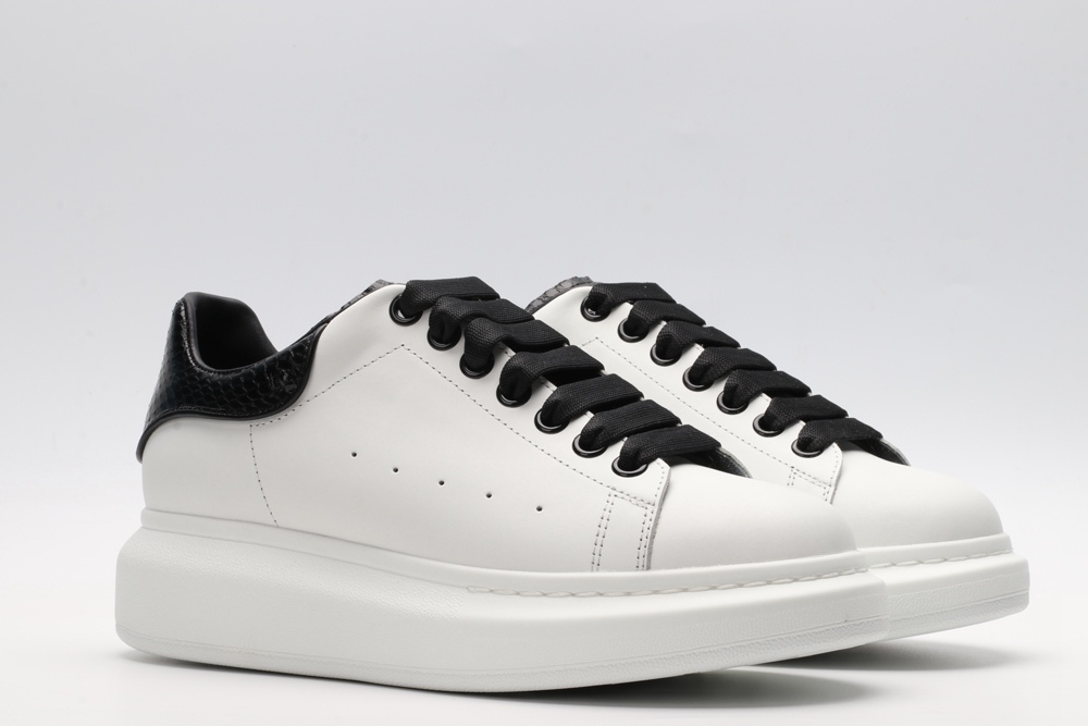 AMQ OVERSIZED SNEAKER with blue stamped python heel