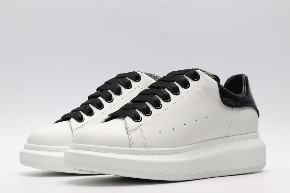 AMQ OVERSIZED SNEAKER with blue stamped python heel