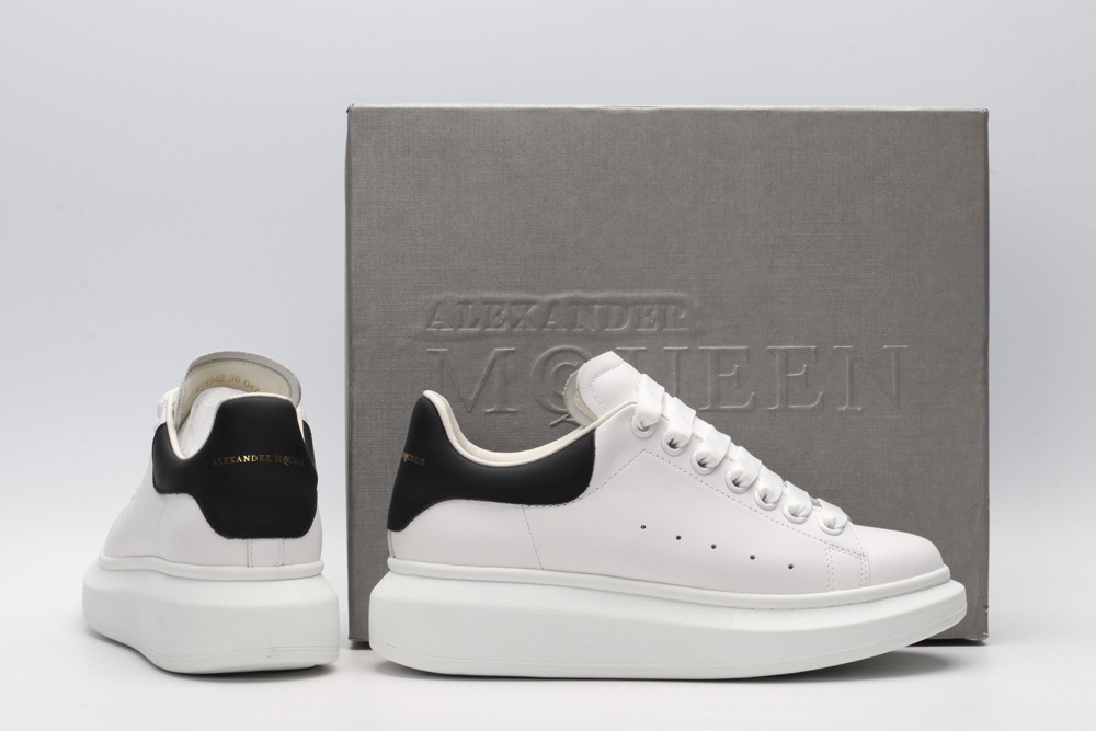 AMQ white oversized sneakers with black heel