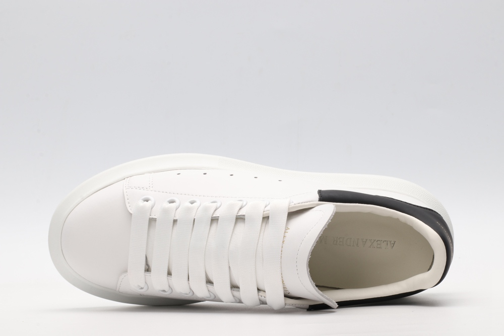AMQ white oversized sneakers with black heel