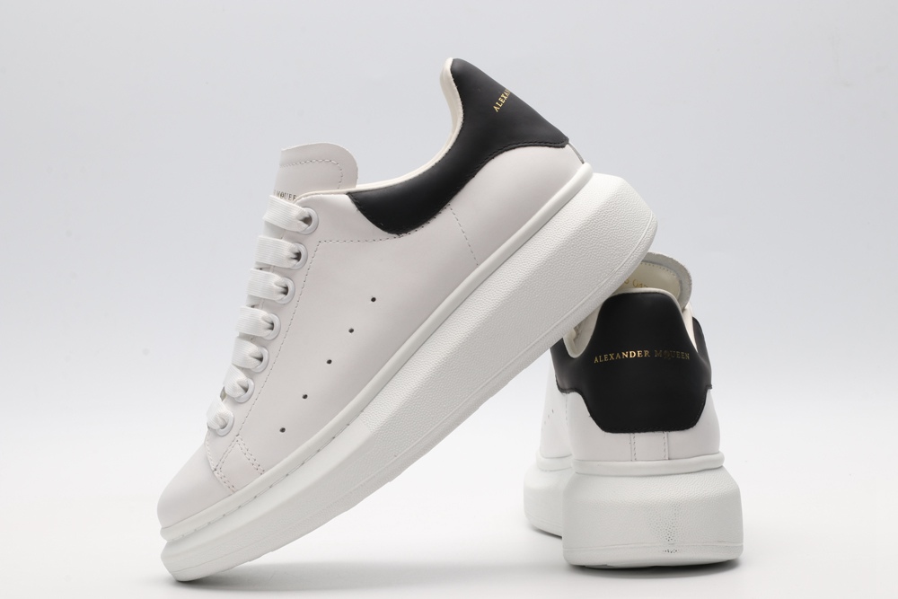 AMQ white oversized sneakers with black heel