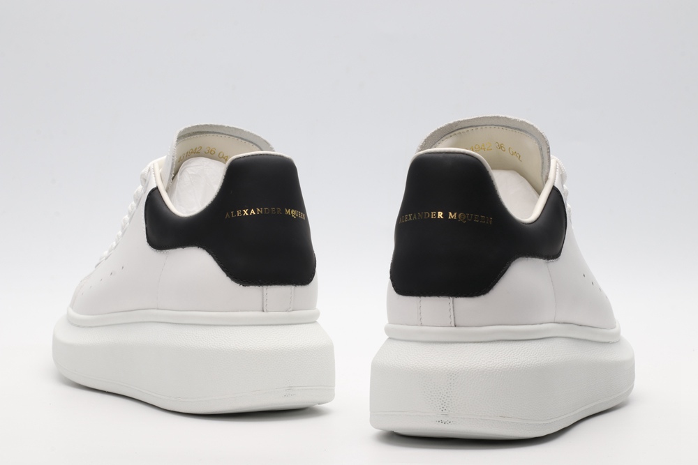 AMQ white oversized sneakers with black heel