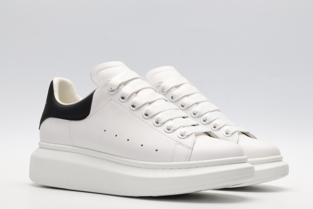 AMQ white oversized sneakers with black heel