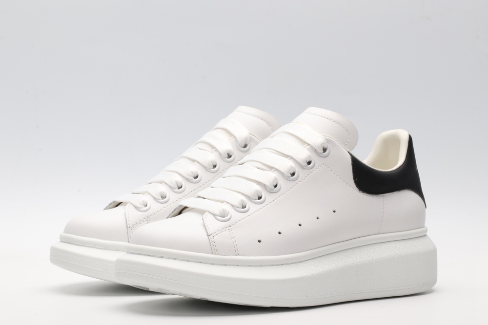 AMQ white oversized sneakers with black heel