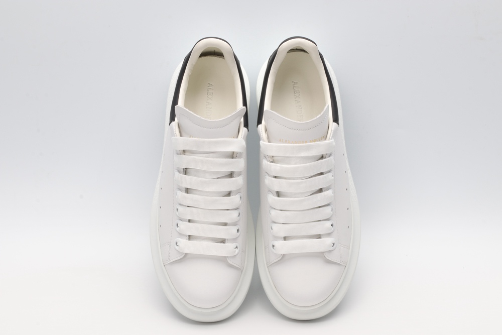AMQ white oversized sneakers with black heel
